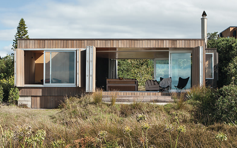 architectural beachside house open shutters