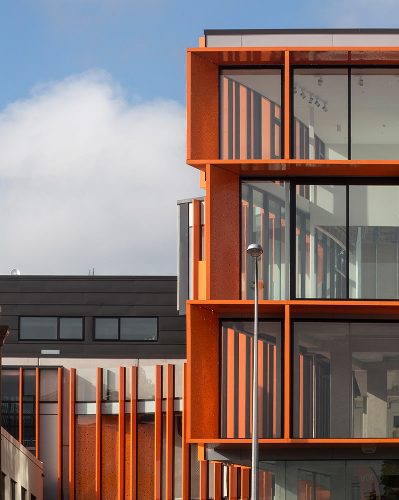 orange textured facade and glazing