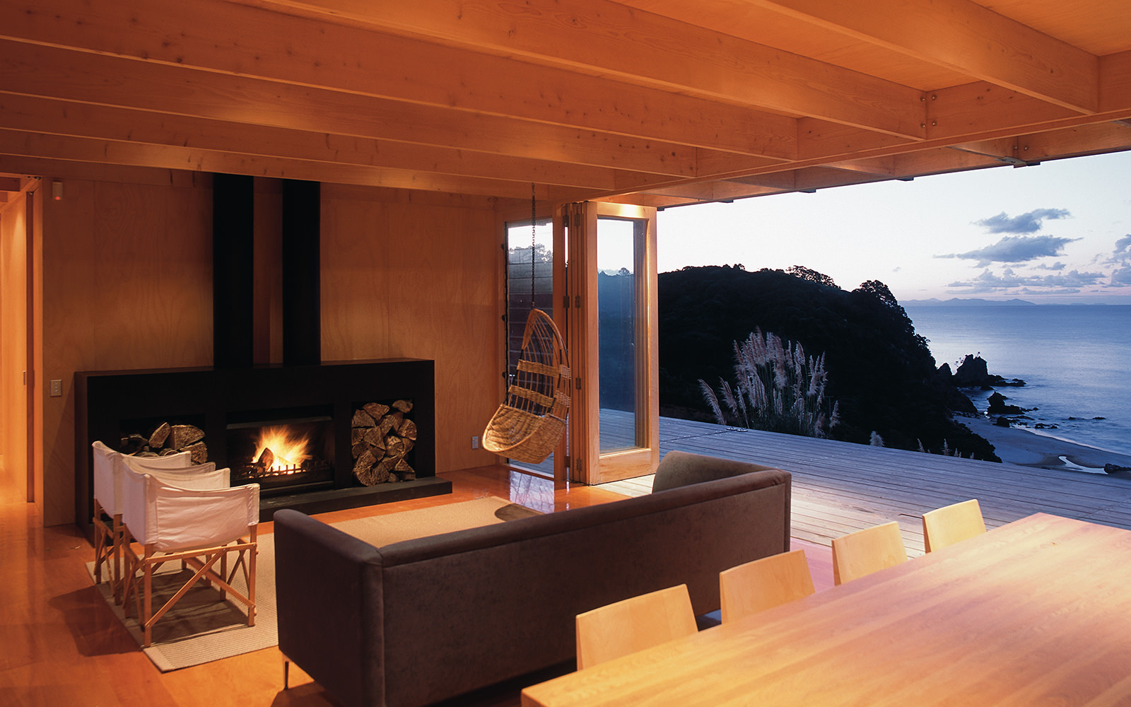 Steel fireplace in timber architectural interior