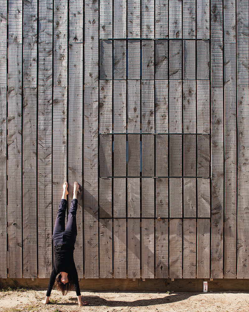 girl doing handstand timber cladding