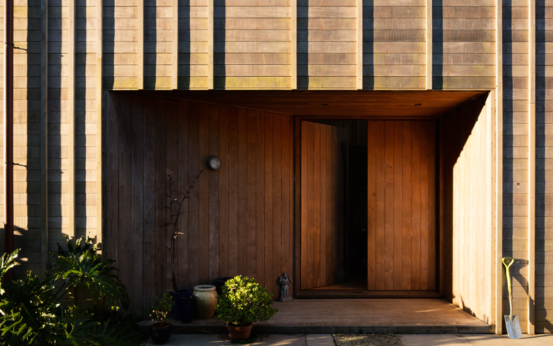 sunlit detail of timber cladding architecture