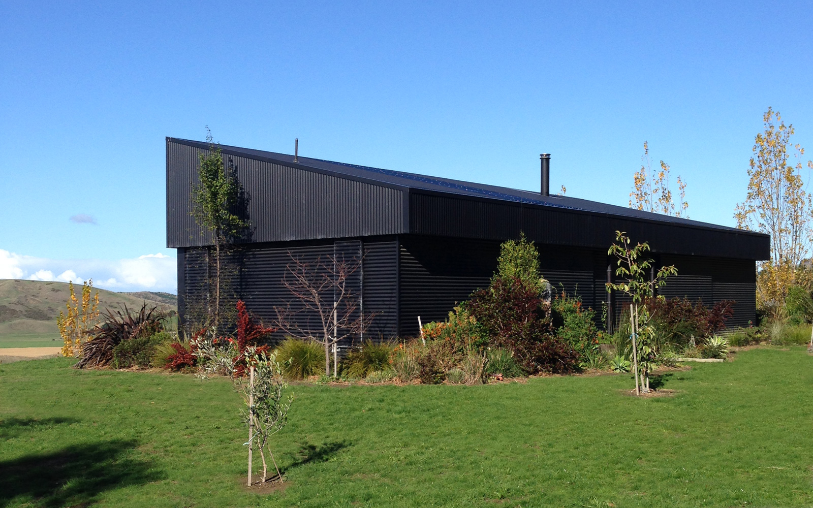 black corrugated cladding shed house